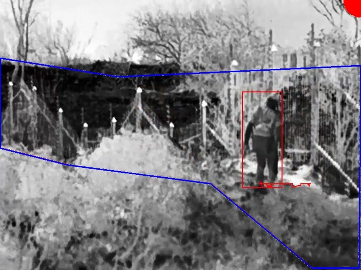 Person detected and boxed inside a drawn zone, on a live perimeter