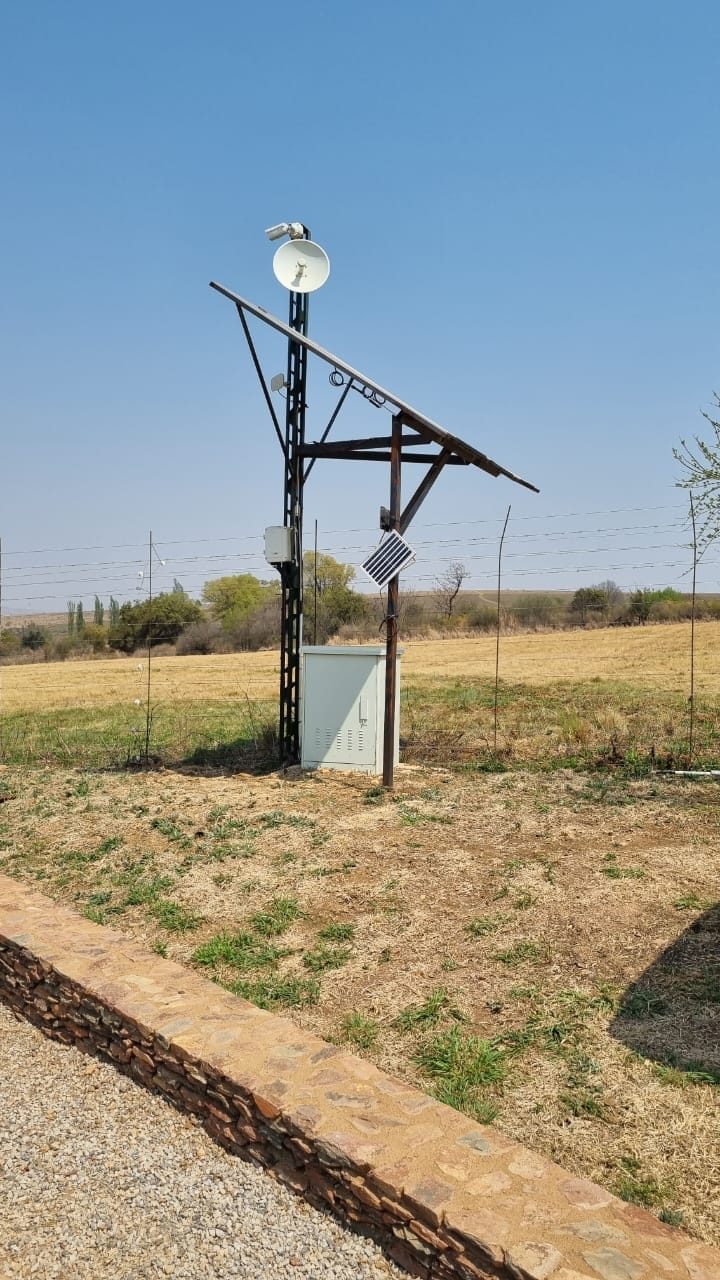 Solar-powered camera and wireless link on a farm boundary